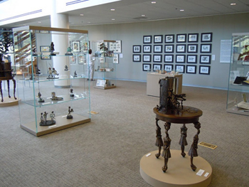 Here is the display of Lewis Carroll materials from the Arne Nixon Center’s extensive collection, including original art by Leonard Weisgard for his 1949 edition of Alice’s Adventures in Wonderland and Through the Looking Glass. Materials on loan included original Alice-themed art by Charles M. Schulz for his "Peanuts" comic strip loaned by the Charles M. Schulz Museum, anamorphic Alice bronze sculptures loaned by artist Karen Mortillaro, and original art loaned by author/illustrator Byron Sewell.